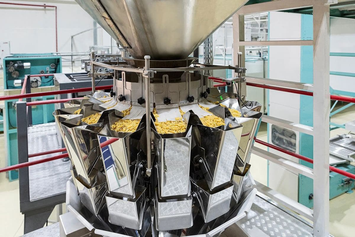 Multihead weigher dosing dry pasta into a packing machine